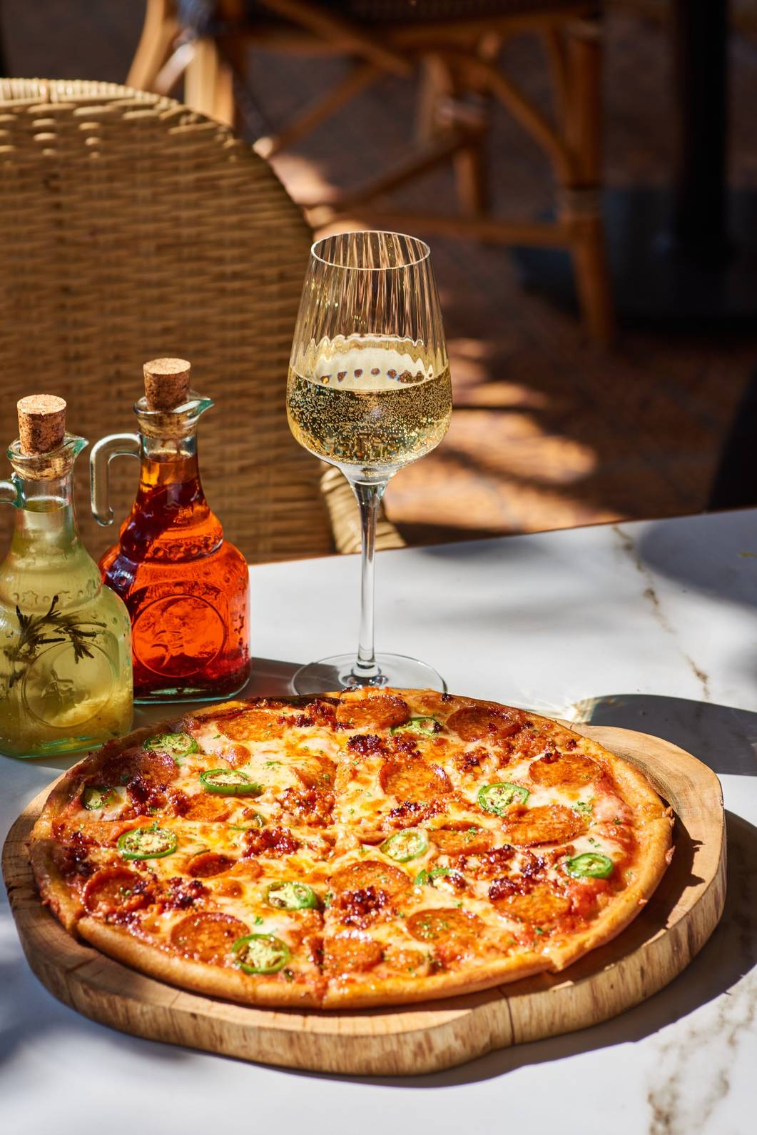 Yummy Pizza with a Drink at a Restaurant in Goregaon